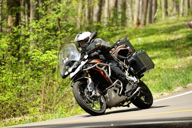 Motorcyclist riding under dramatic weather